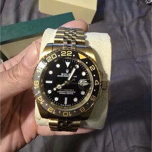 Rolex GMT-Master II Black and Gold Timepiece